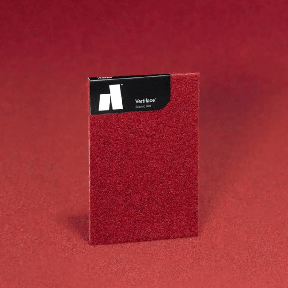 Autex Vertiface® sample in vibrant red color on textured background showcasing acoustic panel texture.