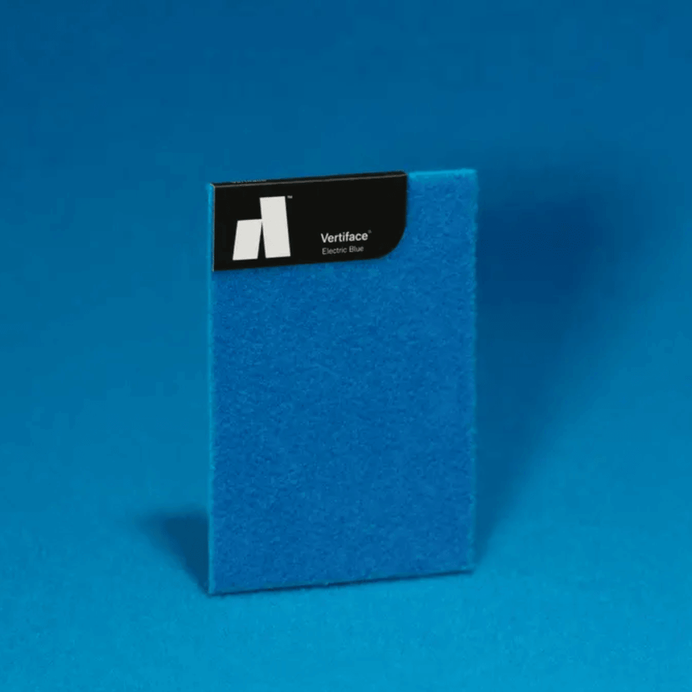Electric blue Vertiface acoustic panel against a blue background, showcasing its texture and color.