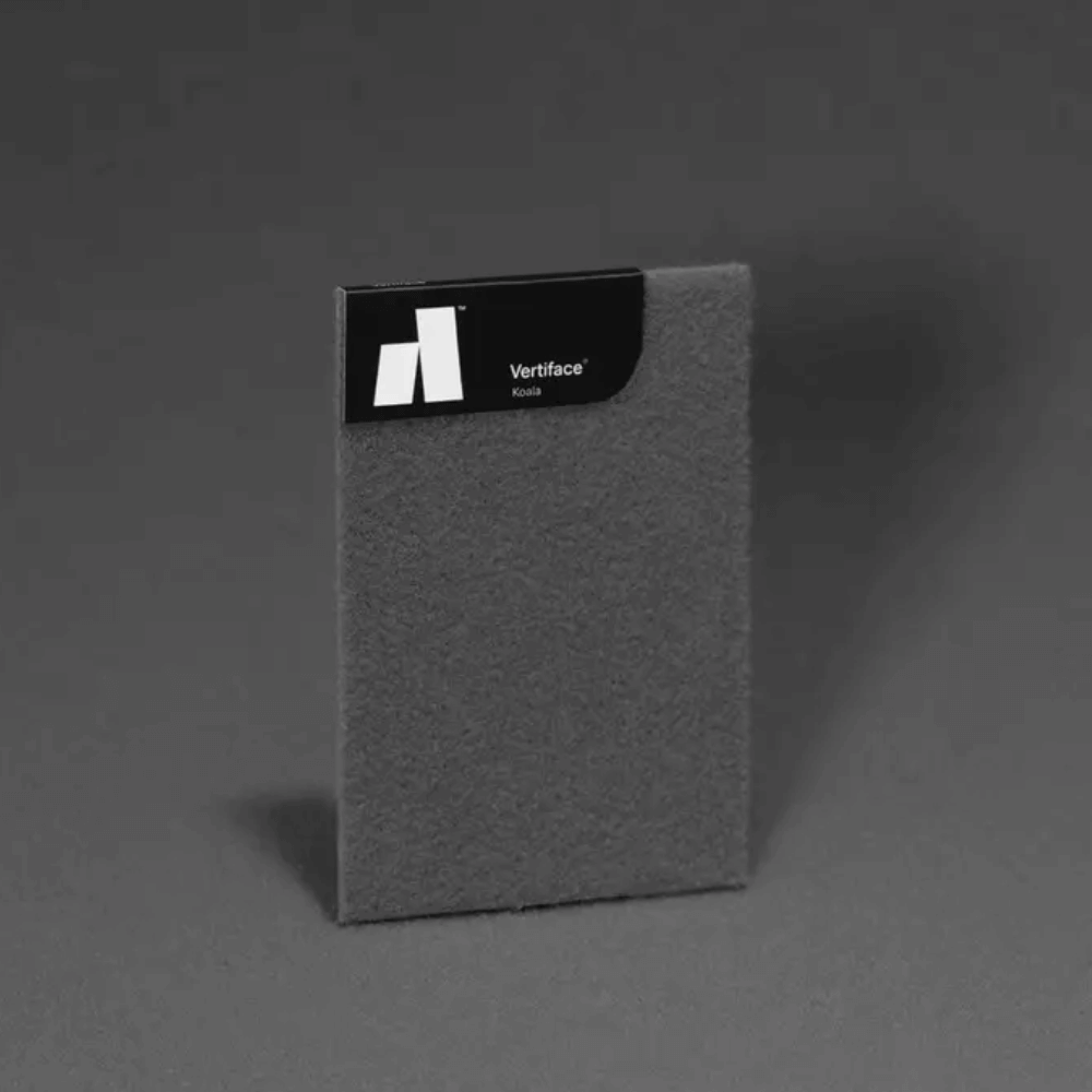 Vertiface® sample card in charcoal texture on a dark background, showcasing its acoustic properties.
