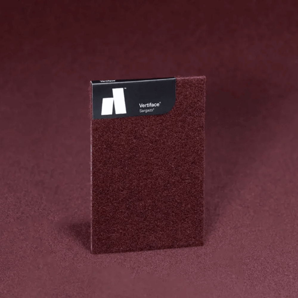 Vertiface® Sargas® acoustic panel sample in rich burgundy on textured background.