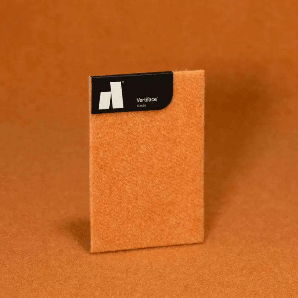 Autex Verifase® sample in soft orange texture against a warm-toned background, showcasing acoustic properties.