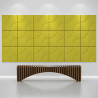 Acoustek Cavasinni acoustic tiles in vibrant yellow on a wall with a contemporary wooden bench below.