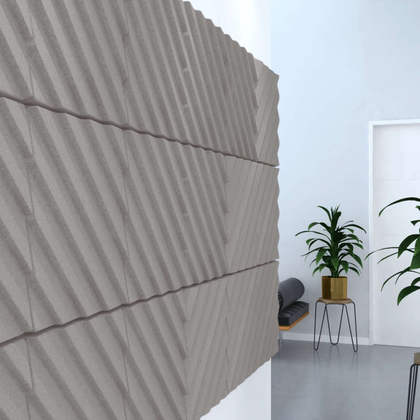 Acoustek Newport Collection acoustic wall tiles in modern interior, featuring textured gray design for noise reduction.