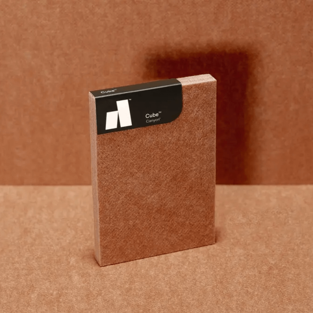 Autex Cube™ Canyon acoustic panel on a textured brown background, showcasing eco-friendly design and style.